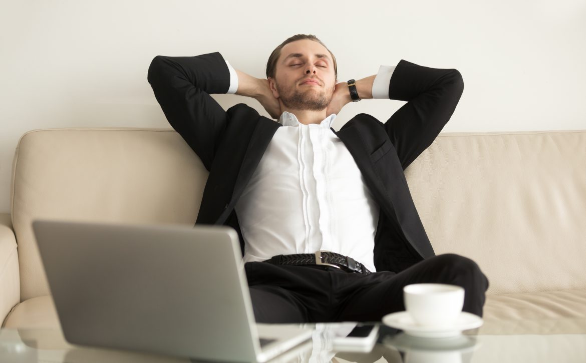 Man relaxing after completing an important work