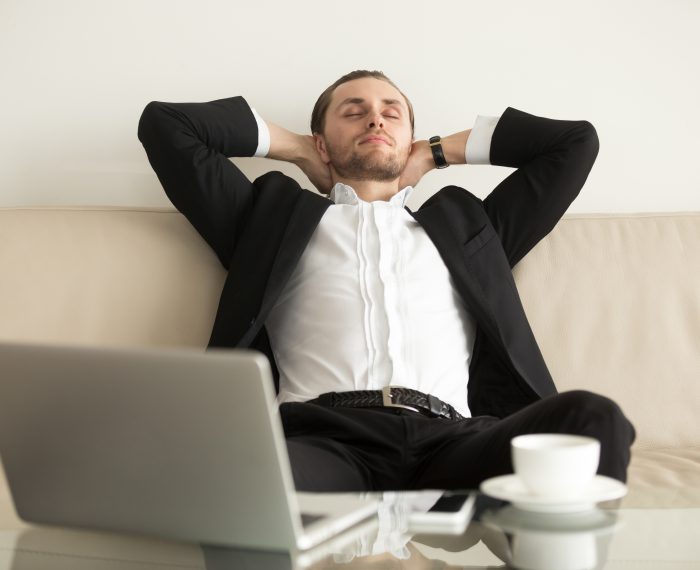 Man relaxing after completing an important work